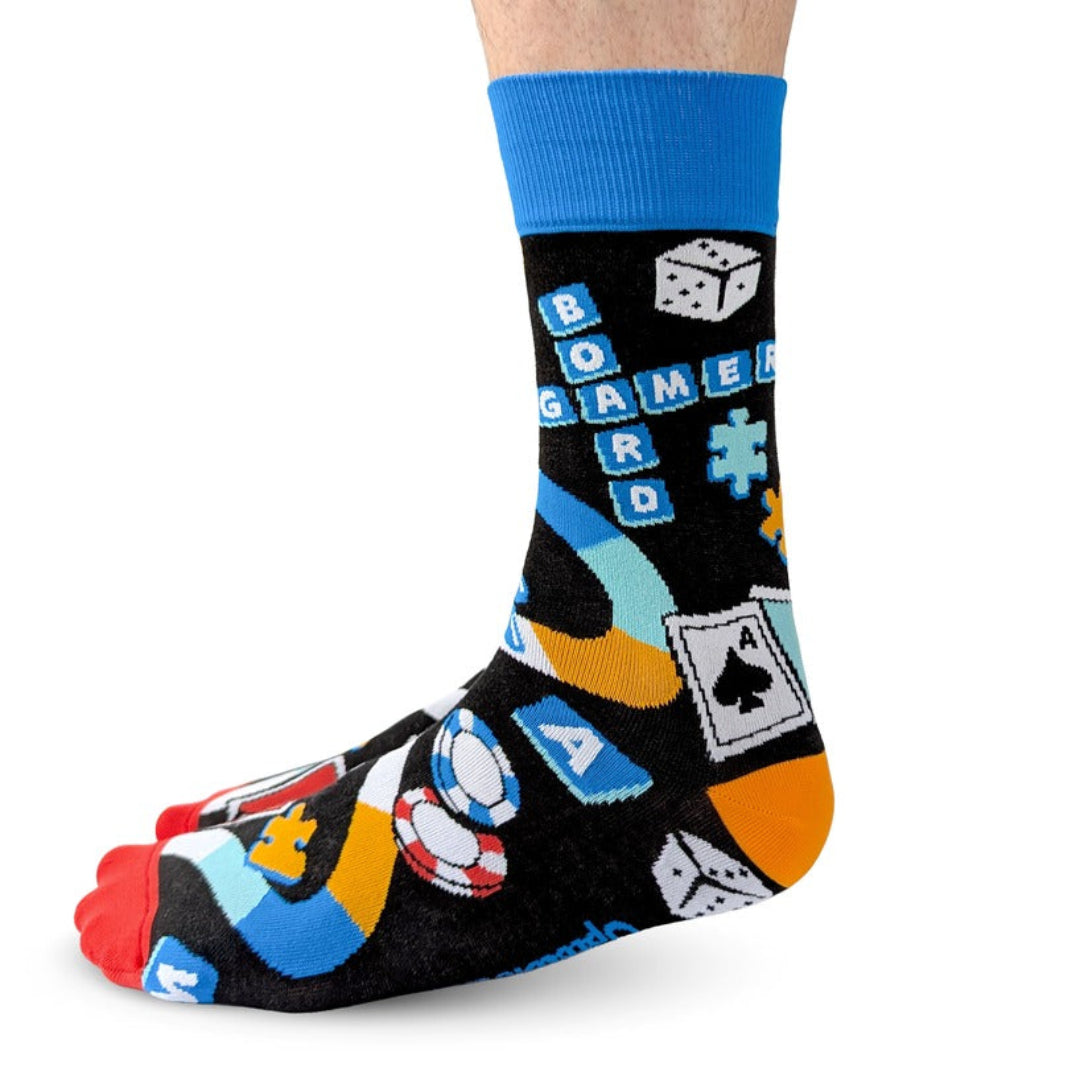 Colorful sock with game-themed design on a white background