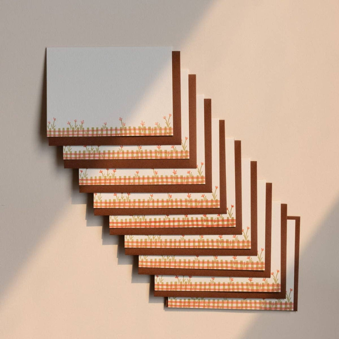 Set of wooden picture frames with checkered pattern on a neutral background