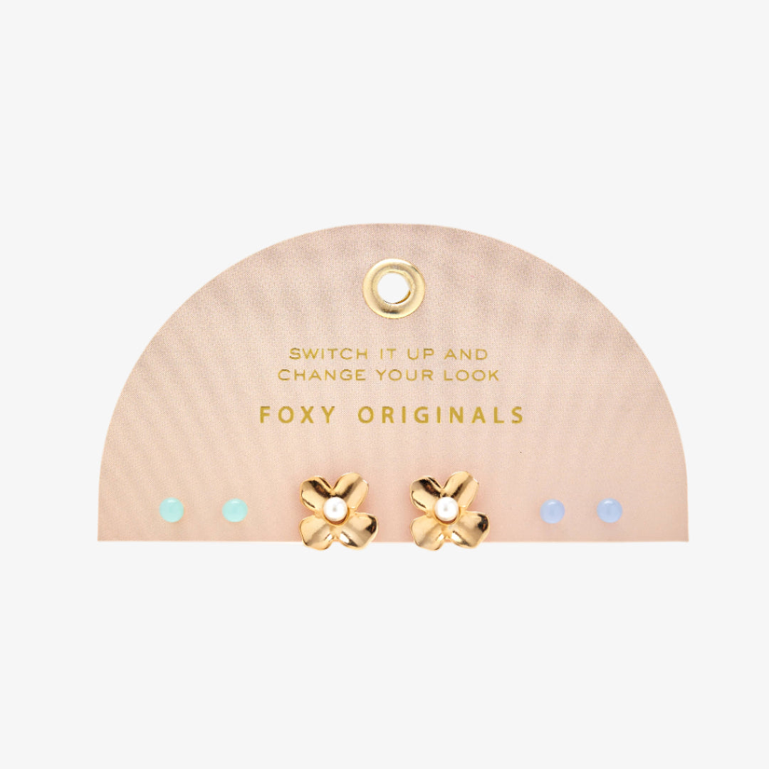 Gold earrings on a pink 'Foxy Originals' branded display card