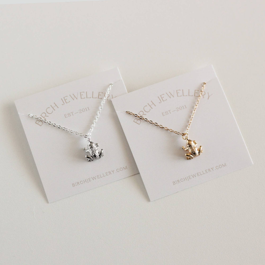 Two necklaces on display cards with 'Burch Jewellery' branding on a light background.