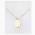Gold necklace with a star pendant on a white card with 'Foxy Originals' branding.