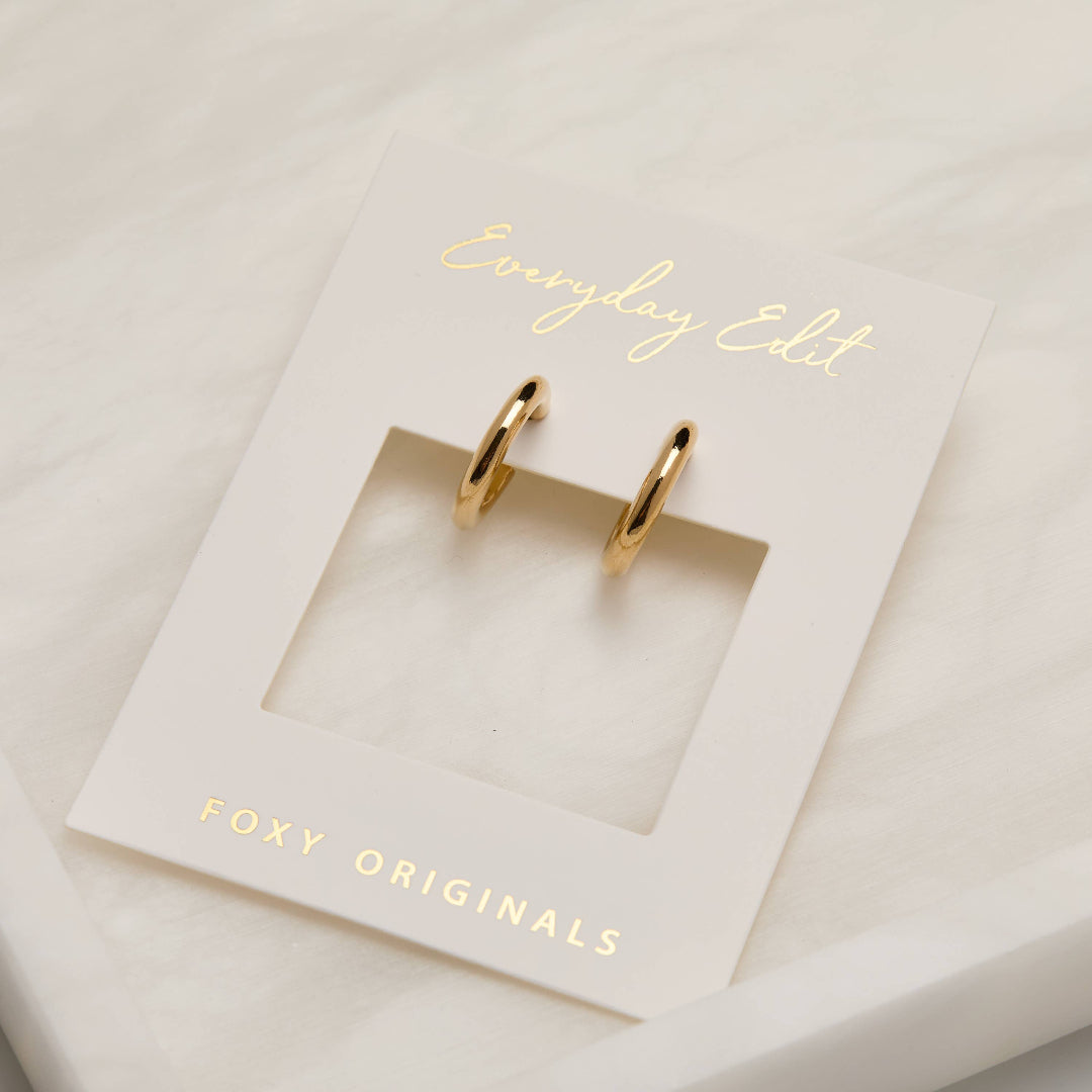 Gold hoop earrings on a 'Foxy Originals' branded card with 'Everyday Edit' text.