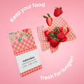An image of the Beeswax Wrap Variety Set and one being used in an envelope style to store blueberries, with the text "keep your food fresh for longer".