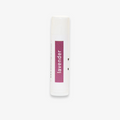 A white tube of lip balm with the word "lavender" printed in purple on the label.