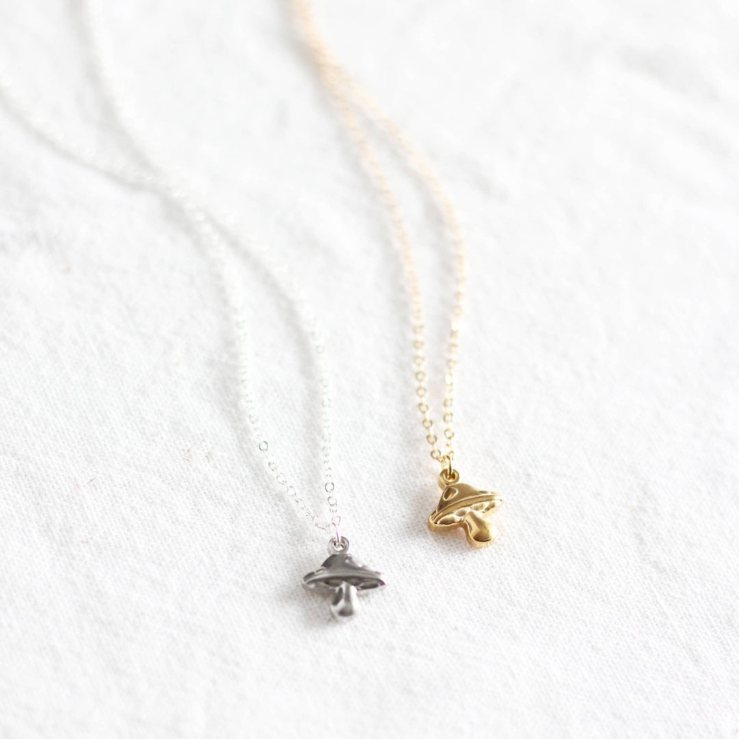 Two necklaces with pendants on a white background