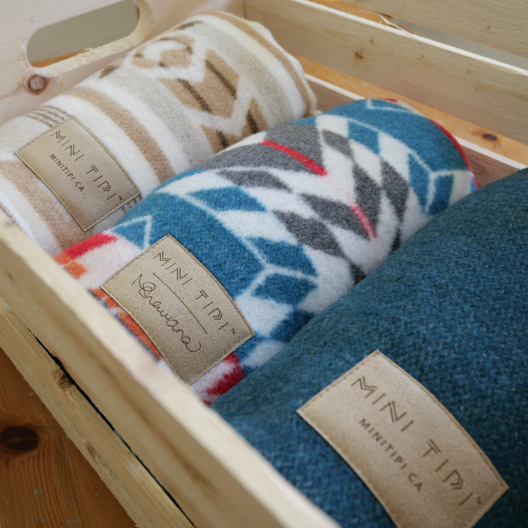 The Nibi and Sand Reversible Blanket by Mini Tipi. This reversible and stylish blanket is available in Ottawa, Ontario, Canada.
