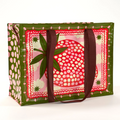 A reusable tote bag with a playful strawberry design. The bag is olive green with brown handles. It features a large pink strawberry in the center, surrounded by white clouds, stars, and pink polka dots. The strawberry has detailed leaves and seeds.