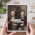 Two men holding a glass with text 'Bourbon is just vegan eggnog' against a Christmas tree background.